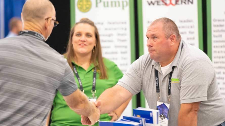 Exhibitor shaking hands with Expo attendee